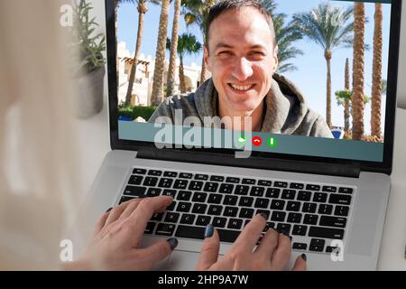 Zoom conference. Business partners communicate via video using laptop. The guy talks with his business partners appearance about plans and strategy Stock Photo