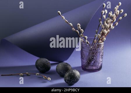 Happy Catholic and orthodox Easter holiday creative background. Easter chicken and quail eggs painted by hand in blue marble stone effect color on vio Stock Photo
