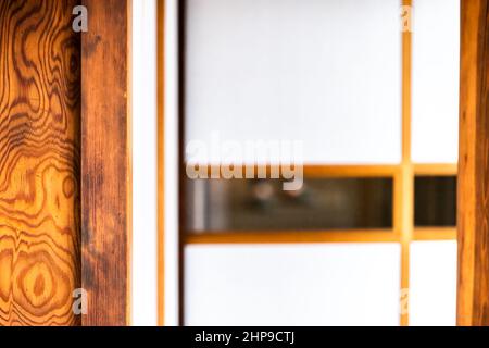 Traditional Japanese house machiya or ryokan in Japan with abstract closeup of shoji sliding paper door open white background in room Stock Photo