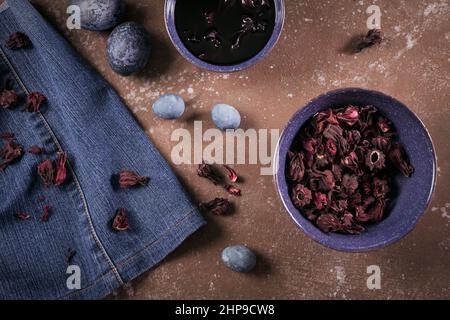 Process of dyeing eggs with natural paints for Easter. Natural ecological staining with food coloring. Painted Organic Materials Easter Eggs. Stock Photo
