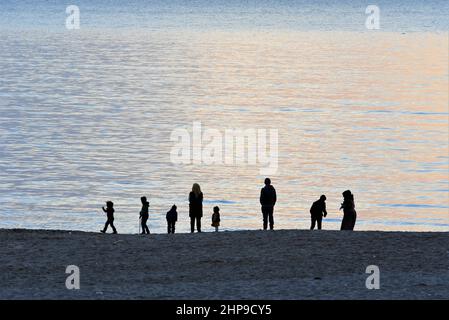 Beirut, Lebanon. 18th Feb, 2022. People enjoy their time on a beach at the coast of Beirut, Lebanon, on Feb. 18, 2022. Credit: Liu Zongya/Xinhua/Alamy Live News Stock Photo