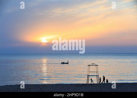 Beirut, Lebanon. 18th Feb, 2022. People enjoy their time on a beach at the coast of Beirut, Lebanon, on Feb. 18, 2022. Credit: Liu Zongya/Xinhua/Alamy Live News Stock Photo