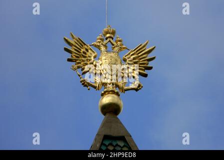 Golden Imperial Russian crowned double-headed eagle topping the steeple of the Wooden Palace in Kolomenskoye, Moscow, Russia Stock Photo