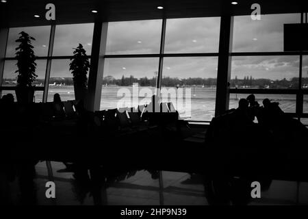 International airport with people in the hall indoor black white photo Stock Photo