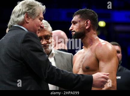 Amir Khan (right) speaks to BBBofC steward Robert W. Smith after losing the Welterweight Contest fight against Kell Brook at the AO Arena, Manchester. Picture date: Saturday February 19, 2022. Stock Photo