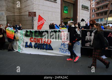 February 19, 2022, Benevento, Campania/Napoli, Italy: Naples, Italy - February 19, 2022 :People show a flag while participating in the event .Woman show a banner during participation in the event. Women and men demonstrated in the center of Naples because they want to fight for a future different from the current one, where relations between peoples are demilitarized and built on social and environmental justice . They say out loud :.-NOT A MAN NOT A EURO TO WAR.-STOP THE MILITARY ESCALATION IN UKRAINE NOW!.It is time for our country to leave NATO, abandon military servitude and demobilize th Stock Photo