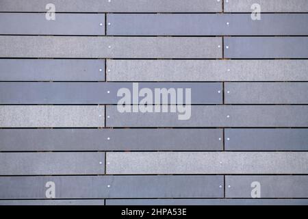 horizontal stripes are gray like textures on the wall Stock Photo