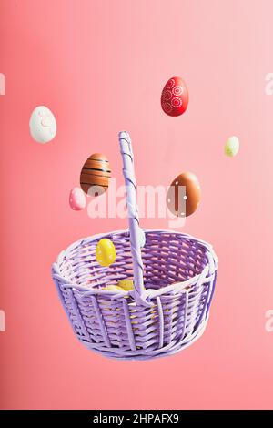 Easter eggs falling into a flying basket, Easter holiday concert Stock Photo