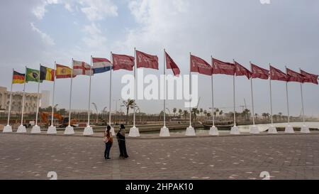 Doha, Qatar - January 15th 2022: Fifa World Cup 2022 Qatar Flags flying at the Corniche Promenade, Doha, Qatar Stock Photo