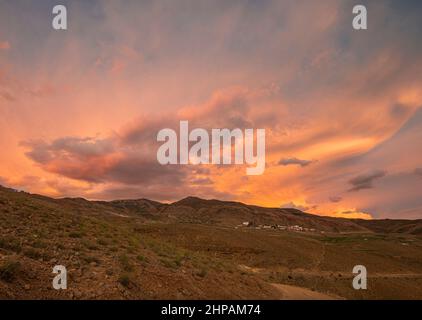 colourful Sunset sky above kibber village, Spiti Valley, Himachal Pradesh, India Stock Photo