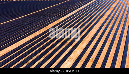 Broken hill power plant of solar panels on a electricity generation farm - aerial top down wide view. Stock Photo