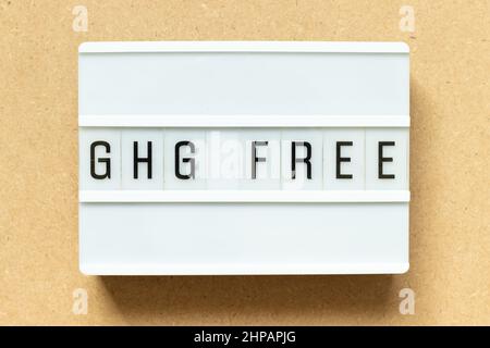 Lightbox with word GHG (Abbreviation of greenhouse gas) free on wood background Stock Photo