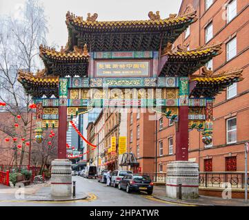 Chinatown archway/gate decorated with dragons & pheonixes can be seen on Faulkner Street, Manchester, England, UK Stock Photo