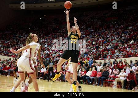 Bloomington, United States. 19th Feb, 2022. Iowa Hawkeyes guard Caitlin Clark (22) goes to the basket against Indiana University during an NCAA women's basketball game in Bloomington, Ind. The Iowa Hawkeyes beat the Indiana University Hoosiers 96-91. Credit: SOPA Images Limited/Alamy Live News Stock Photo