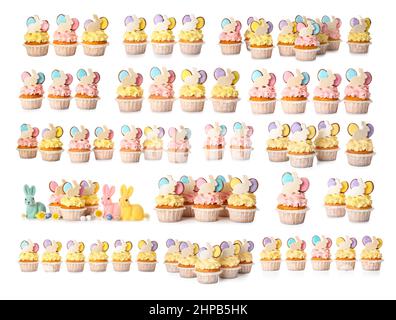 Set of creative Easter cupcakes isolated on white Stock Photo