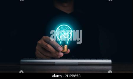 Creative idea management, solution, innovation, knowledge technology, and inspiration concept. The human brain, gears, target icon glowing inside digi Stock Photo