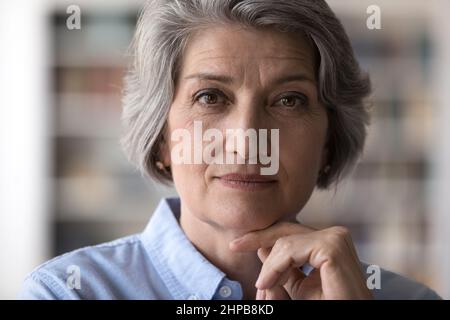 Close up head shot portrait of beautiful older woman. Stock Photo