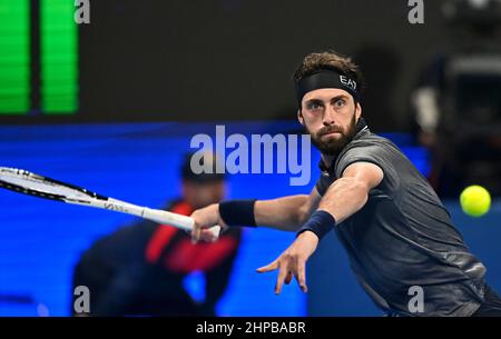 Doha. 19th Feb, 2022. Nikoloz Basilashvili of Georgia returns the ball during the ATP Qatar Open tennis tournament final at the Khalifa International Tennis Complex in Doha, Feb.19, 2022. Credit: Nikku/Xinhua/Alamy Live News Stock Photo