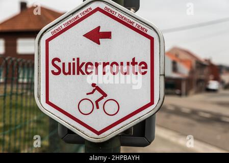 Tienen, Flanders / Belgium -  White red sign of the bicycle trail Sugar route called Suikerroute between the villages and agriculture fields Stock Photo