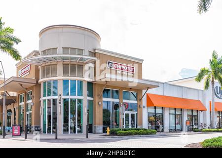 Naples, USA - August 27, 2021: Naples, Florida modern shopping mall area center called Mercato with Chipotle Mexican Grill Restaurant and Ulta store Stock Photo
