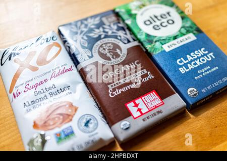 Herndon, USA - October 8, 2021: Three different brands of dark chocolate bars on table with Chocolove, Equal Exchange Chocolates and Alter Eco compani Stock Photo