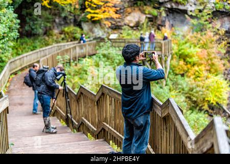 Davis, USA - October 5, 2020: People taking photos picture with phone at Blackwater Falls waterfall in State Park, West Virginia at autumn fall season Stock Photo