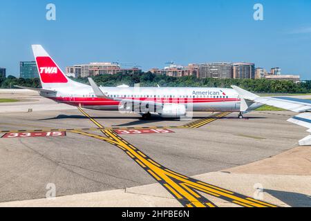 Washington DC, USA - August 25, 2021: Airplane window view of American Airlines in Washington DC Reagan Airport runway gate in Virginia with TWA sign Stock Photo