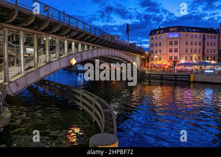 City of Berlin in Germany, Friedrichstrasse Station railway bridge on Spree river in the evening, central Mitte district. Stock Photo