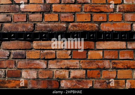 Old brick wall with black bordure Stock Photo