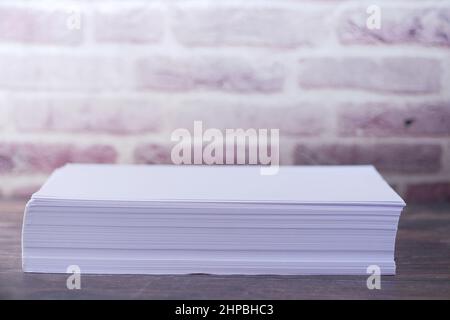 close up of stack of empty paper on table  Stock Photo