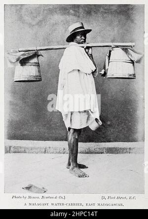 Malagasy water-carrier, east Madagascar. from the book ' The living races of mankind ' a popular illustrated account of the customs, habits, pursuits, feasts & ceremonies of the races of mankind throughout the world by Sir Harry Hamilton Johnston, and Henry Neville Hutchinson Published in London by Hutchinson & Co. in 1902 Stock Photo