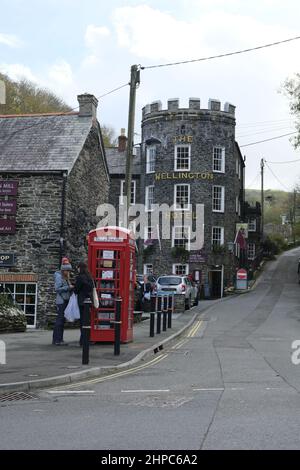 Boscastle, UK-October 2021: The Wellington Mill and The Wellington Hotel in Boscastle are prominent stone buildings in the cornish village Stock Photo