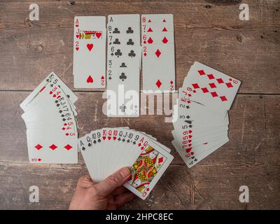 Playing out a contract Bridge Hand with winning bid hand of six no trumps with twenty nine points for the rubber Stock Photo