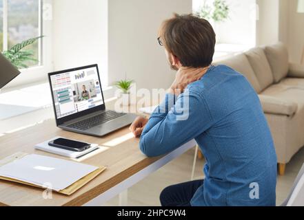 Man work on computer suffer from neck pain Stock Photo