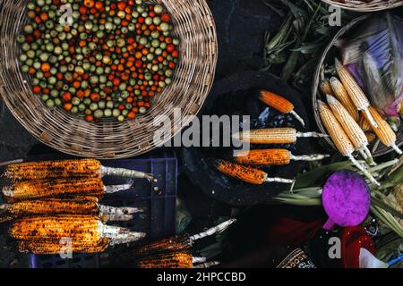 Top view of corns and various kinds of dishes on the table Stock Photo