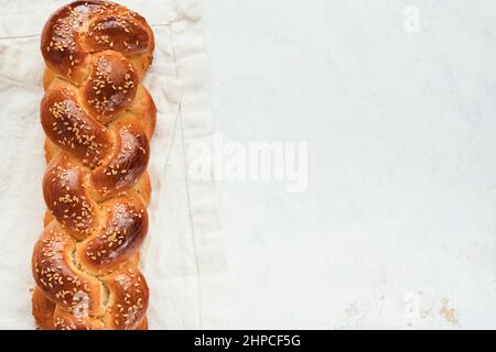 Challah bread. Sabbath kiddush ceremony composition. Freshly baked homemade braided challah bread for Shabbat and Holidays on white background, Shabba Stock Photo