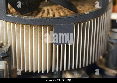 Old computer system unit with spider web and dust inside. Stock Photo