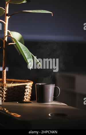 Cup of Tea with Hot Smoke and Lit Candle. on the Desk at Home, Power Outage  (focus on Cup). Stock Photo - Image of flame, evening: 233286940