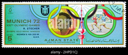 MOSCOW, RUSSIA - NOVEMBER 4, 2021: Postage stamp printed in Ajman shows Renate Stecher (1950), GDR, Summer Olympic Games 1972 - Munich (Medals) serie, Stock Photo