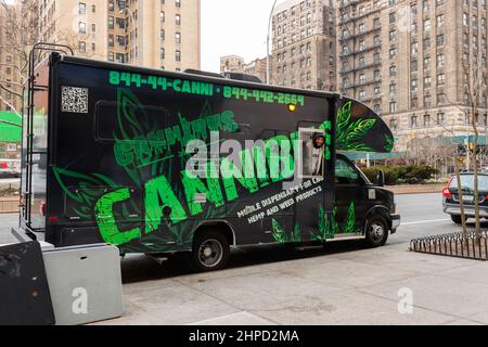 worker looks out the window of a Cannibus, a mobile dispensary for CBD, hemp, pot and marijuana products, parked on the Upper West Side of New York, a Stock Photo