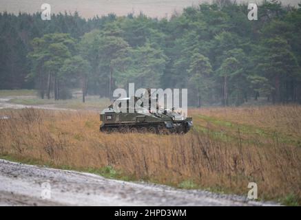 british army FV103 Spartan light armored vehicle in action on a military exercise Stock Photo