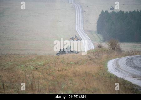 british army FV103 Spartan light armored vehicle in action on a military exercise Stock Photo