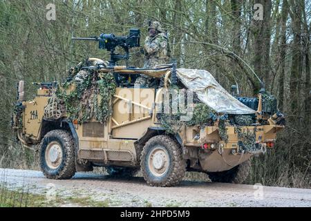 British army Supacat Jackal 4x4 rapid assault, fire support and reconnaissance vehicles on a military battle training exercise, Wiltshire UK Stock Photo