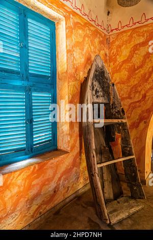 Interior of a building on Prison Island with wooden furniture, Zanzibar, Tanzania Stock Photo