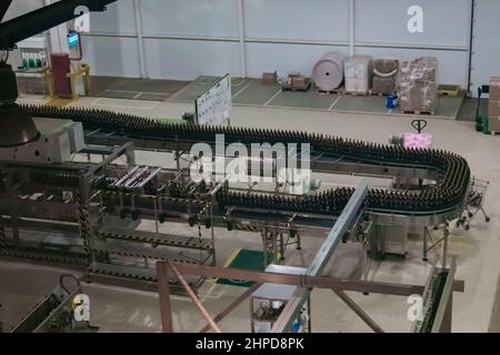 Beer production line - conveyor belt with plastic bottles Stock Photo