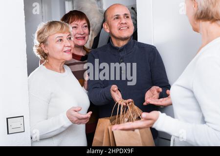 Mature friends are talking about their leisure Stock Photo