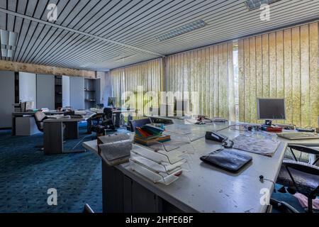 Deserted office with mold. Open plan office. Stock Photo
