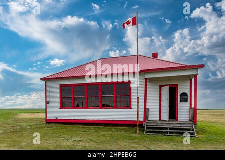 The exterior of the abandoned St. Johns Schoolhouse on the prairies near Leader, Saskatchewan Stock Photo