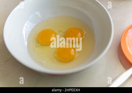 three egg on a white bowl Stock Photo