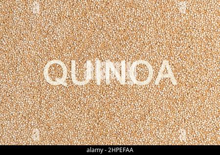Culinary background, beige quinoa seeds. Healthy food. Horizontal view. Stock Photo